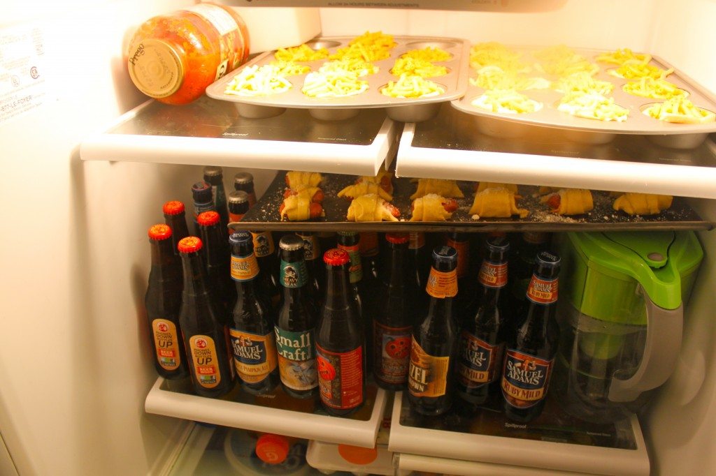 A fridge fool of beer and man food.