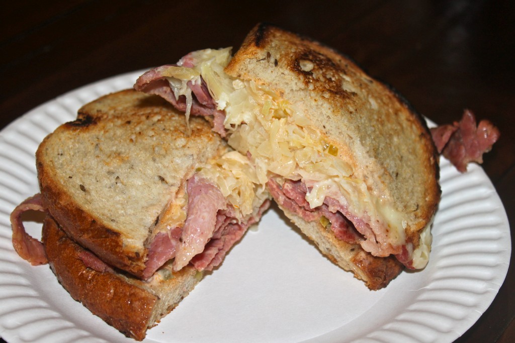 The Classic Reuben: hot corned beef, griddled sauerkraut, swiss and russian on rye bread.