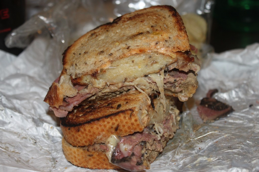 "The Star and The Shamrock": hot pastrami, corned beef, chopped chicken liver, swiss, russian and a potato latke on rye bread