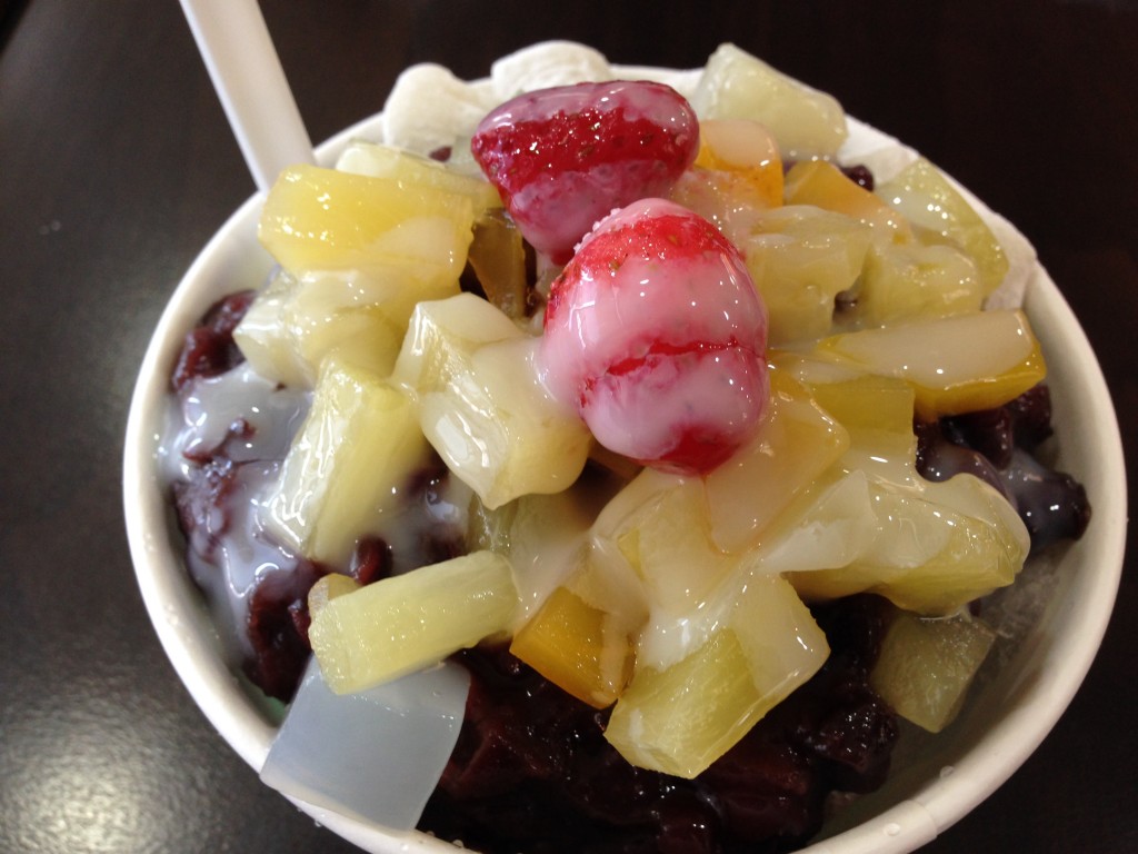 Bingsu: Shaved Ice with milk, Sweetened Red Beans, fruit and various other toppings.  A traditional Korean  summer dessert from a rest stop near the DMZ.