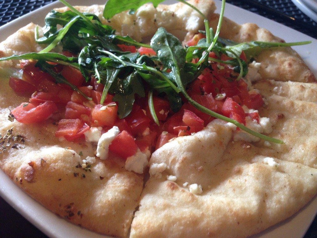 "Grilled Cheese" with tomato, barrel-aged feta, oregano and olive oil at Cava Mezze. 