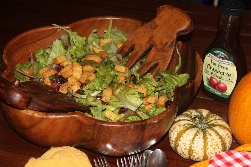 A Fall salad with pumpkin cornbread croutons, craisins, pumpkin seeds and cranberry vinaigrette.  Not from a cookbook, just to lighten things up.