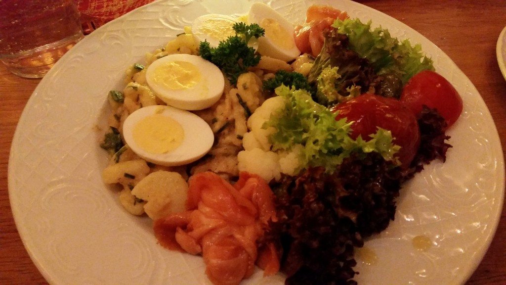 Smoked salmon salad with eggs and potato.