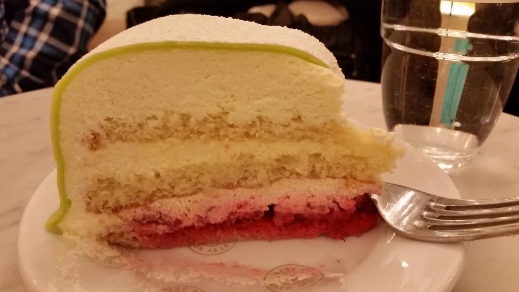 Inside of the princess cake, a layer cake with strawberries and cream, topped with marzipan fondant.
