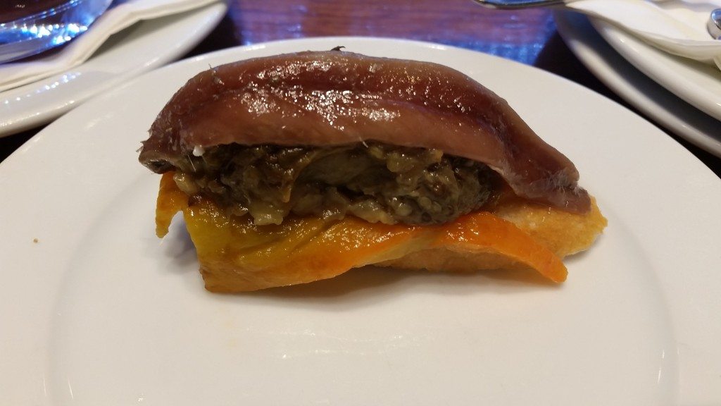 Tostada with sardines, eggplant and roasted red peppers.