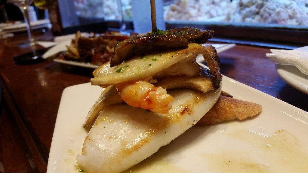 Tostada with a delightful stack of seafood.