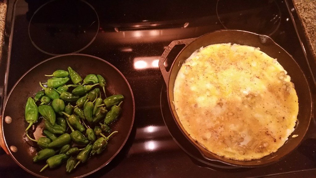 The making of fried Padrón peppers and a Tortilla Española