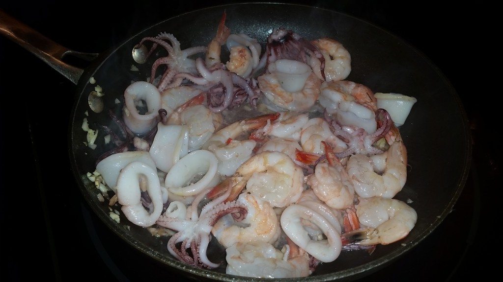 We were going to do grilled squid and garlic shrimp, but by the time we got to this course we were both getting full and ready to be off of our feet, so we combined them into one big delicious garlic seafood dish.  I've always loved the ones with the legs!