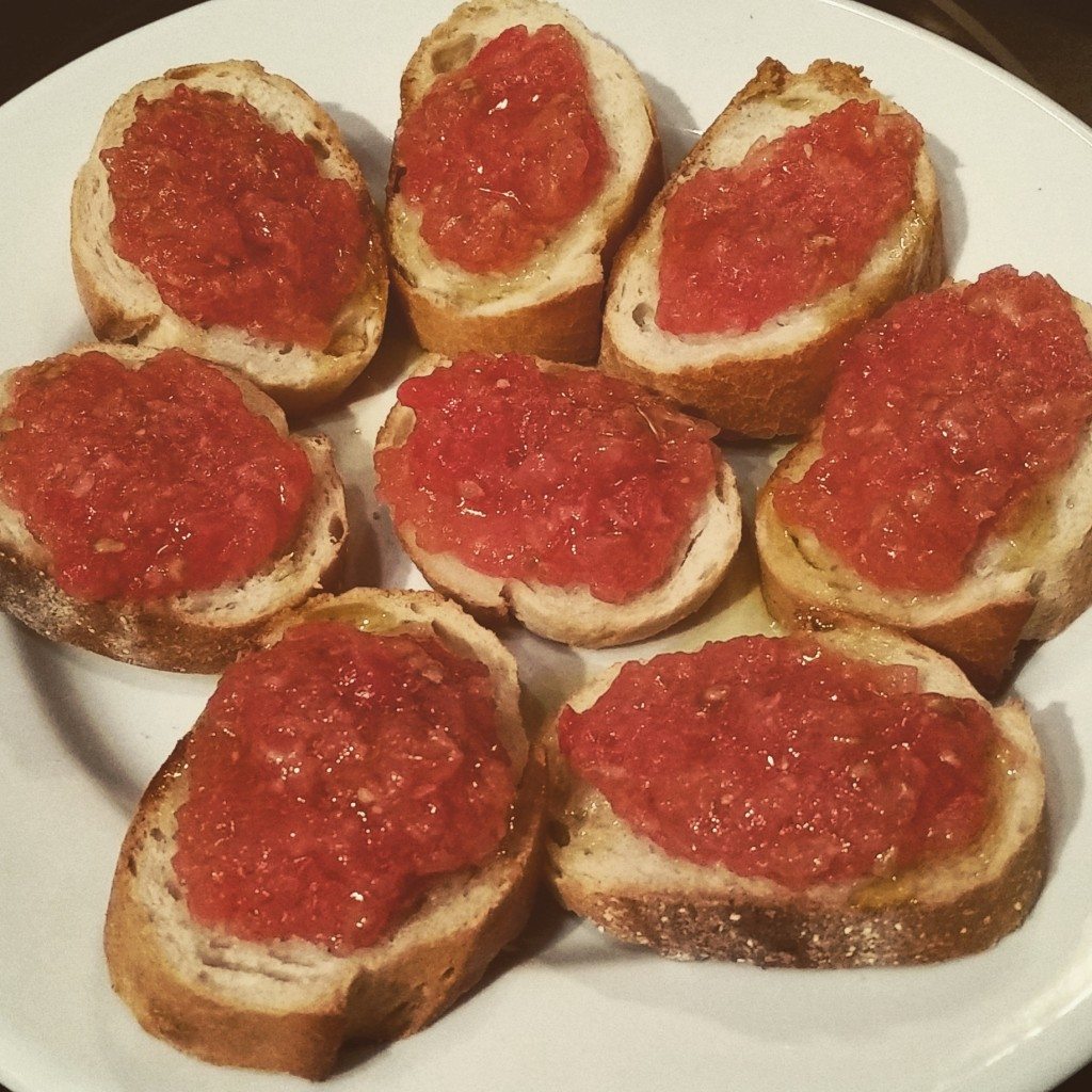 Pan con tomate.  We simply grated tomato and garlic, spread it on toasted bread and drizzled it with olive oil!