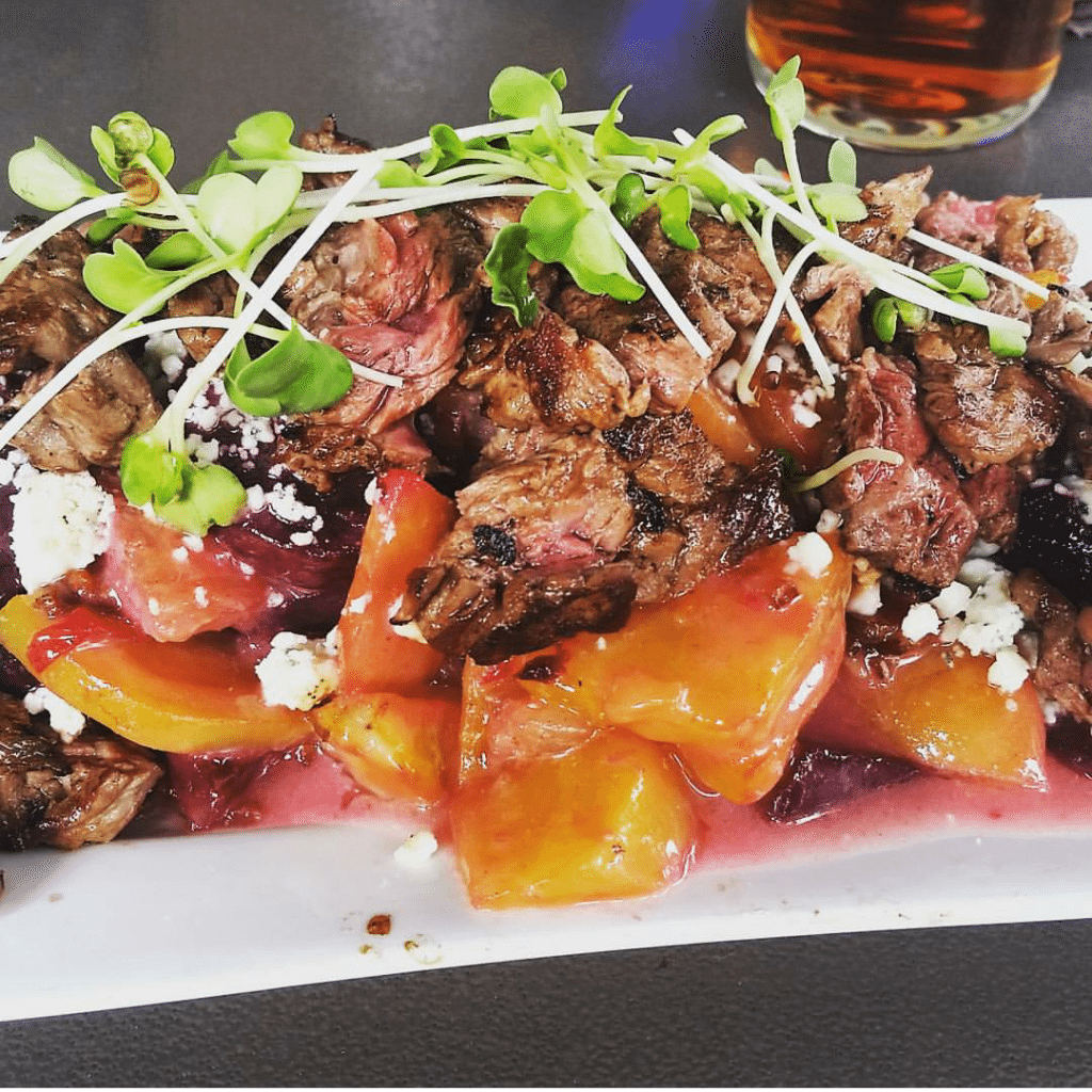 I loved this so much, I ordered it twice during a recent trip to Jackson Hole, WY! Roasted beet salad with walnuts, bacon, gorgonzola and truffle honey vinaigrette topped with local wagyu steak at Snake River Brew Pub. Now how's that for bar food?!