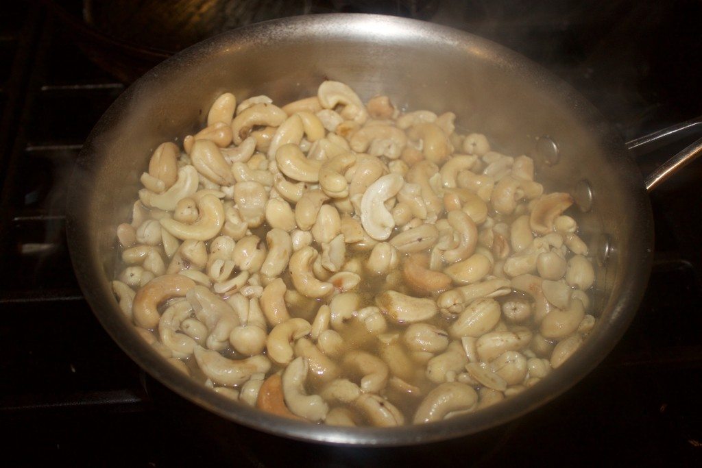 Boil cashews in broth.