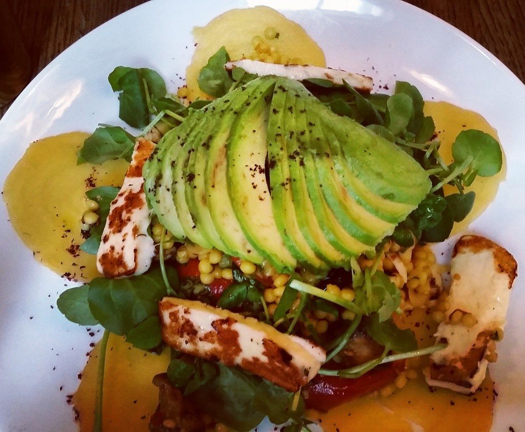 Israeli cous cous with roasted eggplant, golden beets, toasted almonds, baba ghanoush, fresh herb salad, halloumi and avocado.